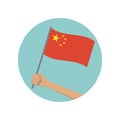 China waving flag circle icon. Hand holding Chinese flag. Red national symbol with yellow stars. Vector illustration Royalty Free Stock Photo